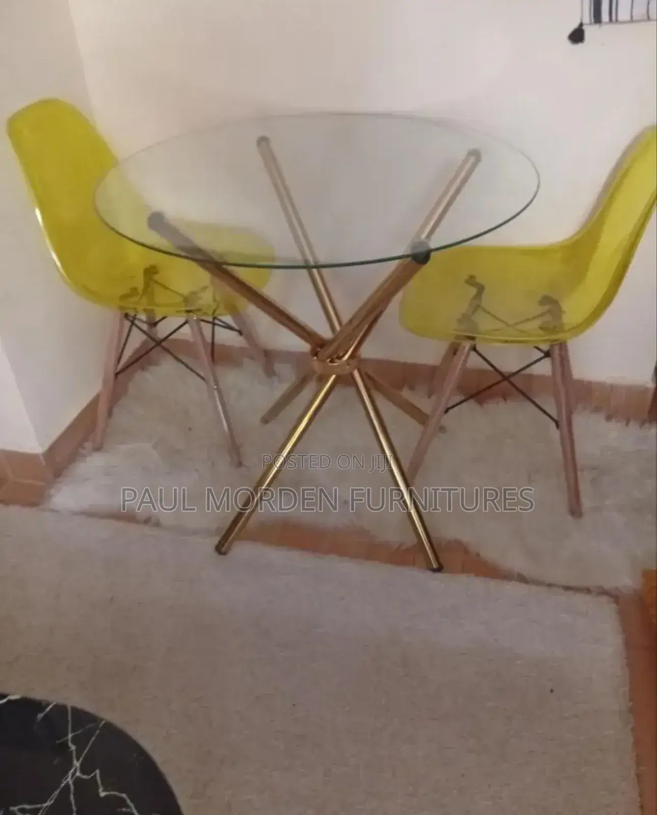 Outdoor Dining Table With Gold Stands and Two Dining Chairs