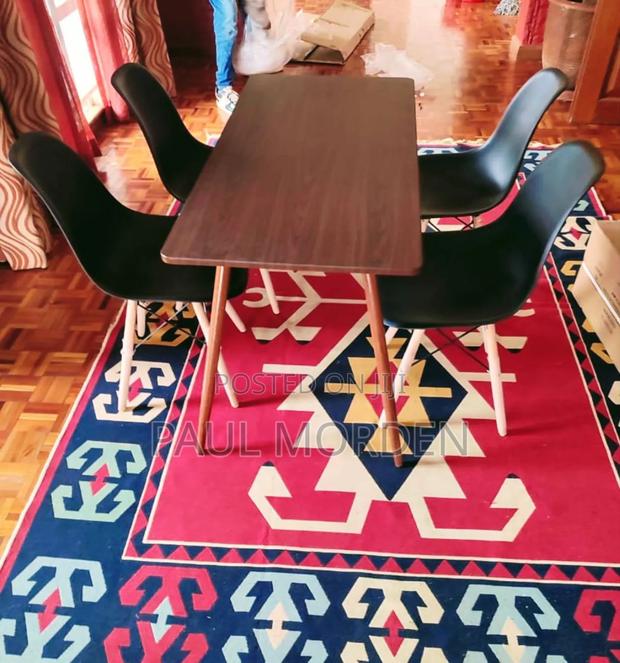 Brown Dining Table With Four Dining Chairs