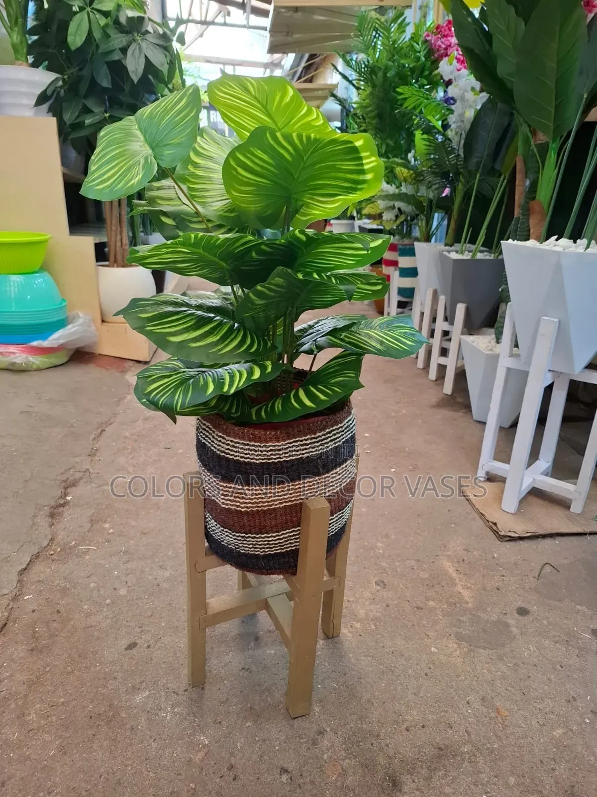 Basket, Stand and Artificial Plant With Decorative Stones