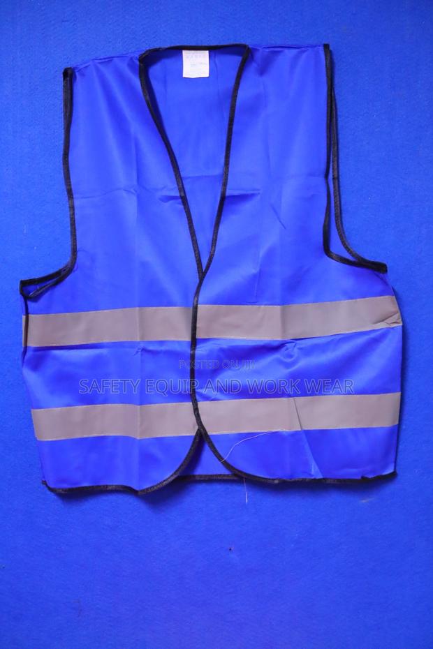 Reflective Vest With A Black Piping.