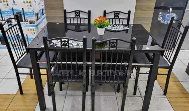 Executive 6 Sitter Glass Dinning Table With Leather Seat