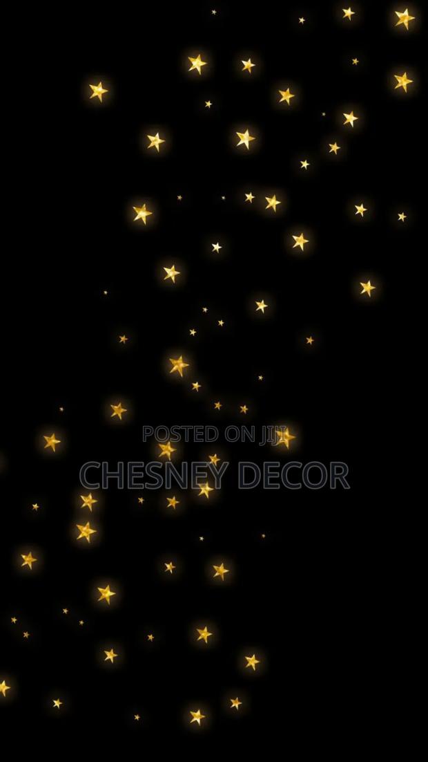 Gold Stars on Black Wallpaper