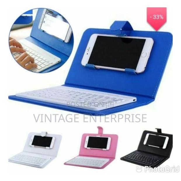 Multifunctional Bluetooth Keyboard and Leather Case Pouch - thumbnail 2