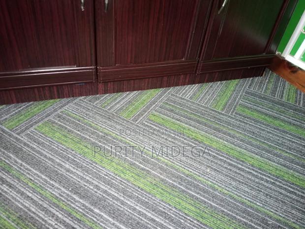 Green and Shed of Grey Carpet Tiles