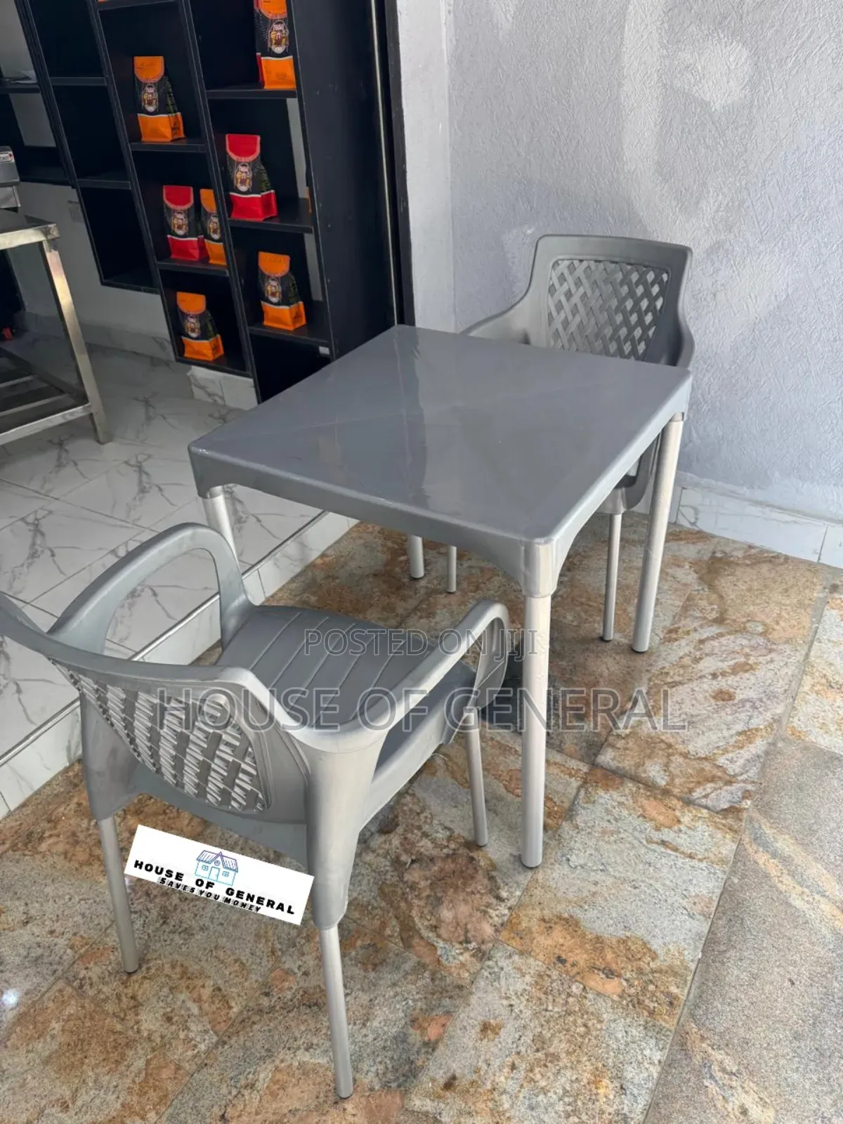 2 Plastic Chair With Metal Tubing and 1 Plastic Table