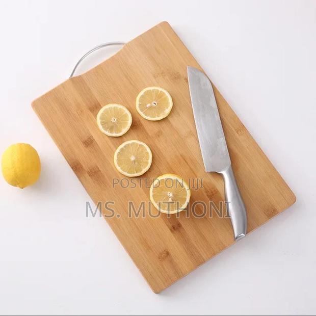 Heavy Wooden Chopping Board With Metallic Handle. - main view