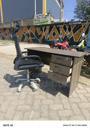 Brown Table and Headrest Office Chair
