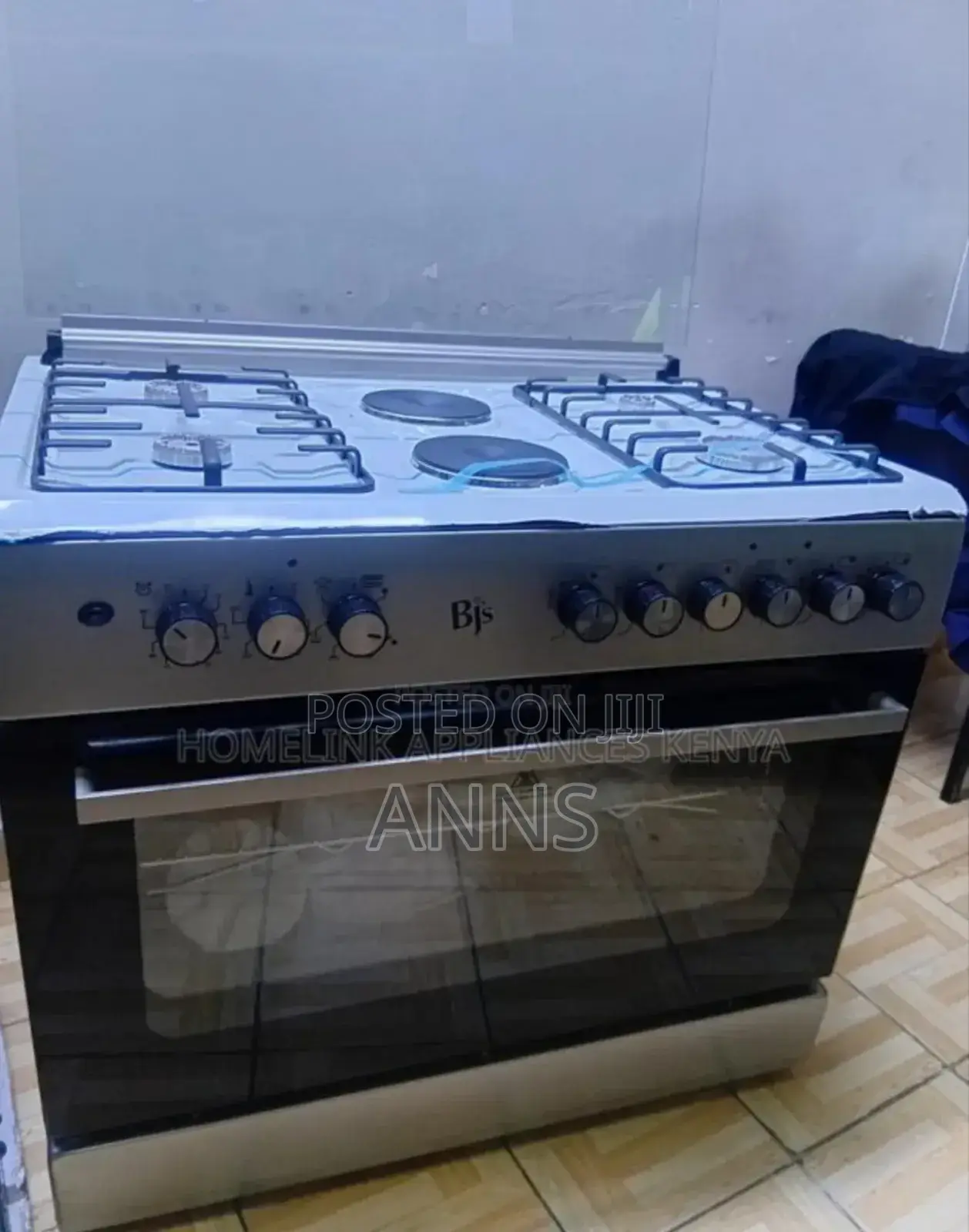 Black and White. BJS 60by90 Cooker 4gas 2electric Plate 
