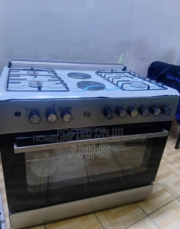 Black and White. BJS 60by90 Cooker 4gas 2electric Plate 