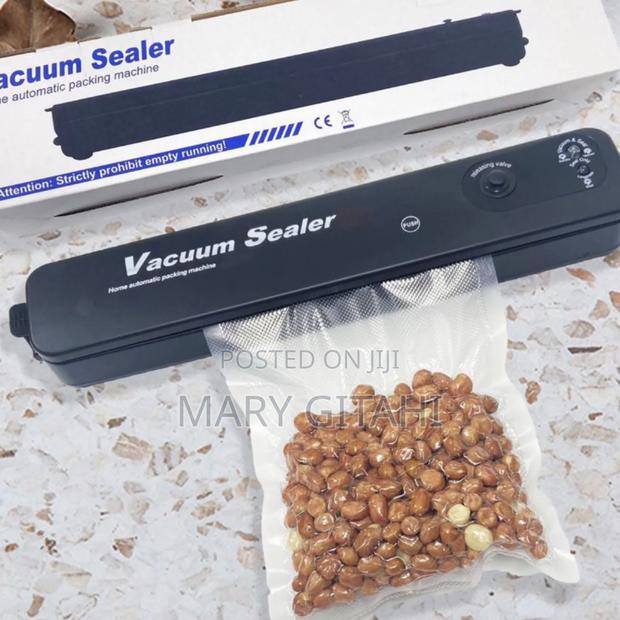 *Vacuum Thermal Sealer.** at