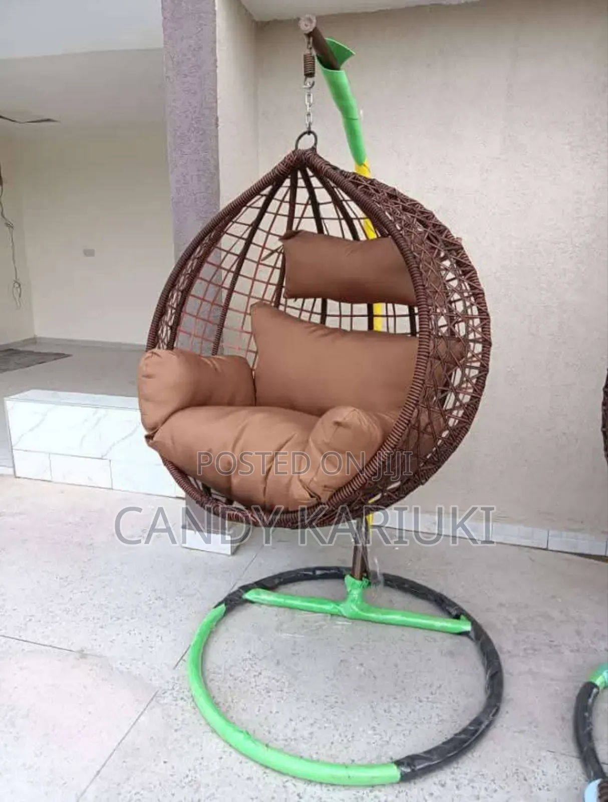 Outdoor Swing With Brown Cushions