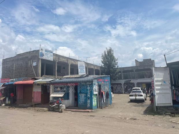 Commercial 50/100 With 10 Shops 2 BR Units(Incomplete)