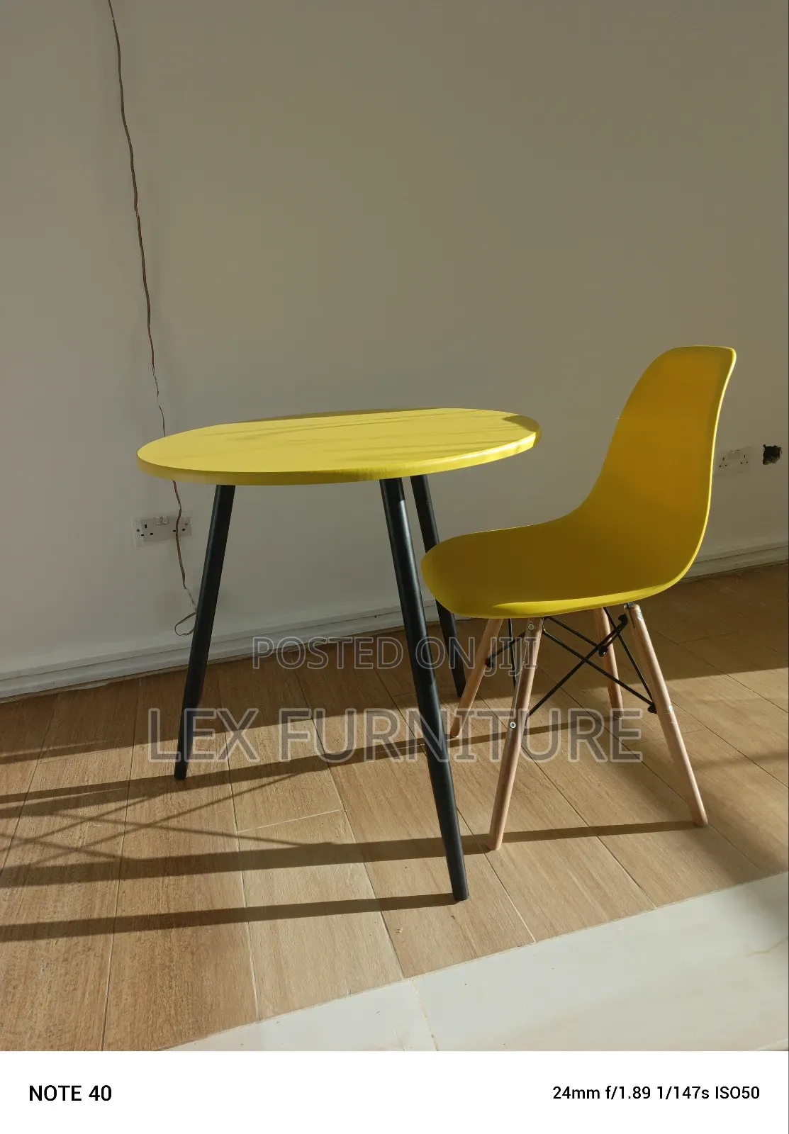 Yellow and Black Table Plus Eames Chair