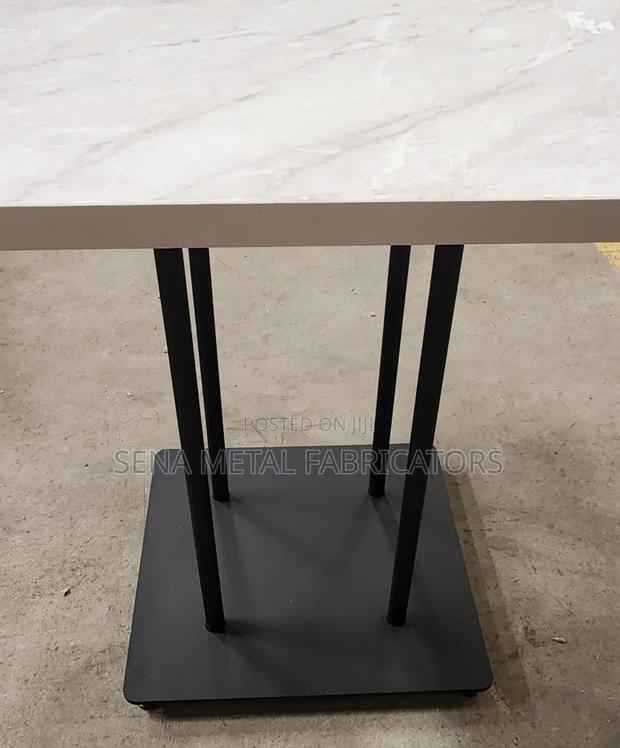 Cream Marble Look Table With Powdercoating Finish.