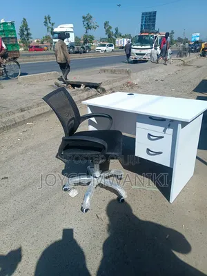 Office Desk and a Mesh Chair. ,