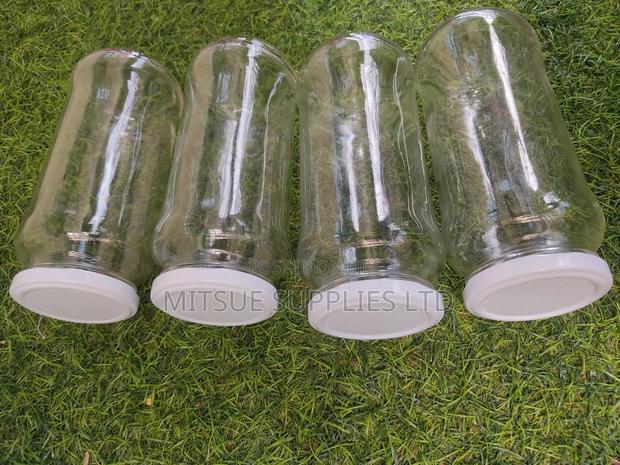 A Set of 12 Glass/Spice Jars 580ml Long With Black/White Lid