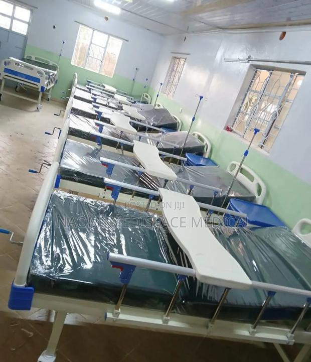 Single Crank Hospital Bed With Matress and an Overbed Table