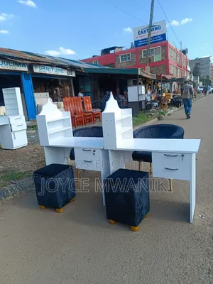 Manicure Set, White Board Table, and Black Seats