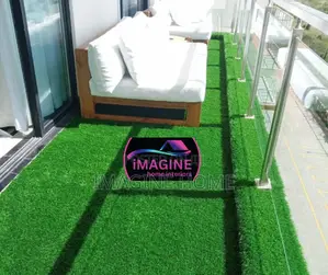 Chair Sits Space With Artificial Green Fences