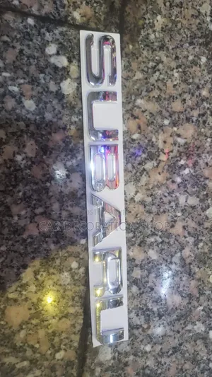 Chrome Subaru Letter Badge