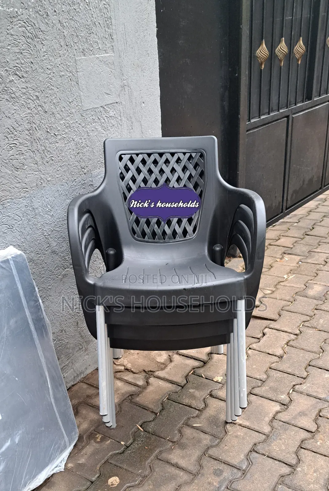 Black Plastic Chair With Metal Tubing Legs