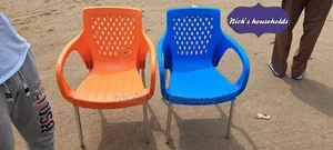 2 Plastic Chairs With Armrest and Metallic Legs