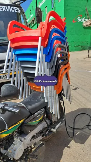 Colorful Plastic Chairs With Metal Tubing Legs And Arms