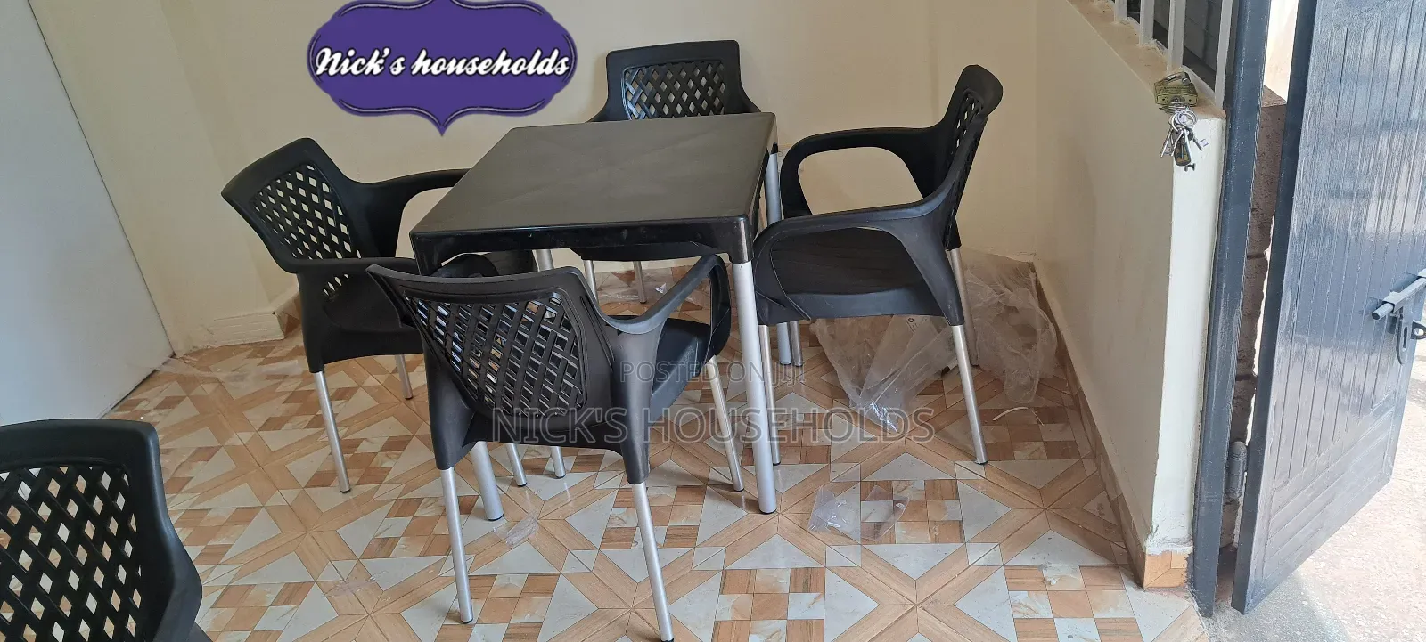 Hotel Plastic Chairs and a Table With Metal Tubing Legs Set