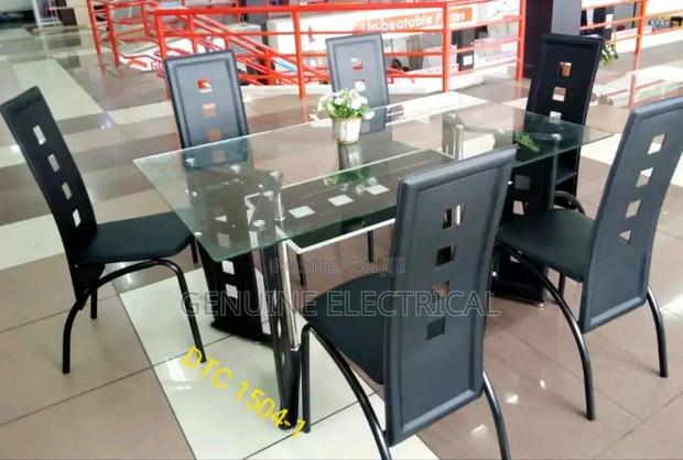 Glass Dinning Table 6 Set With Metallic Leather Seats - main view