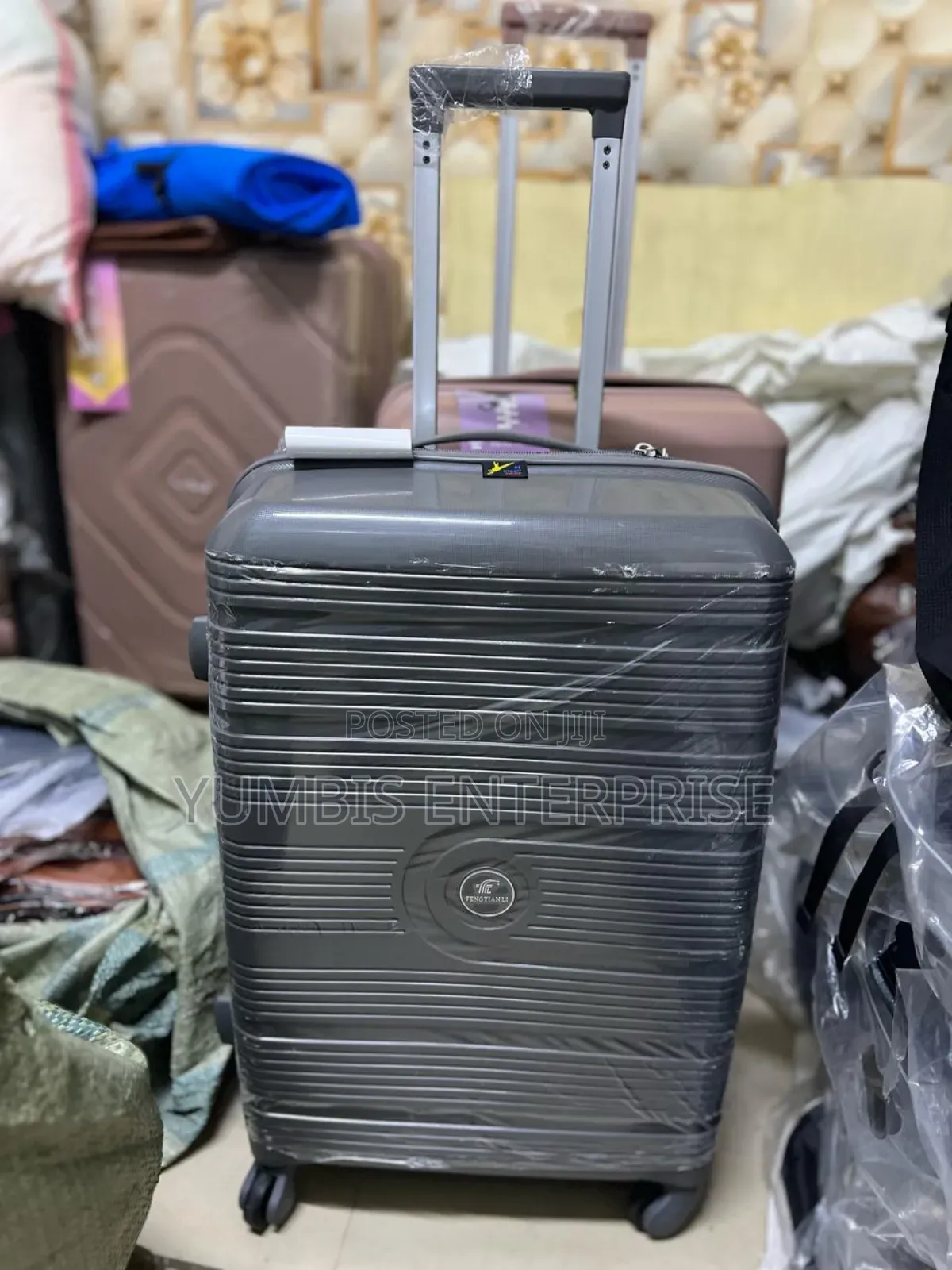 Grey Quality ____Rubber ____Suitcase Size _Medium at 4000 SHS