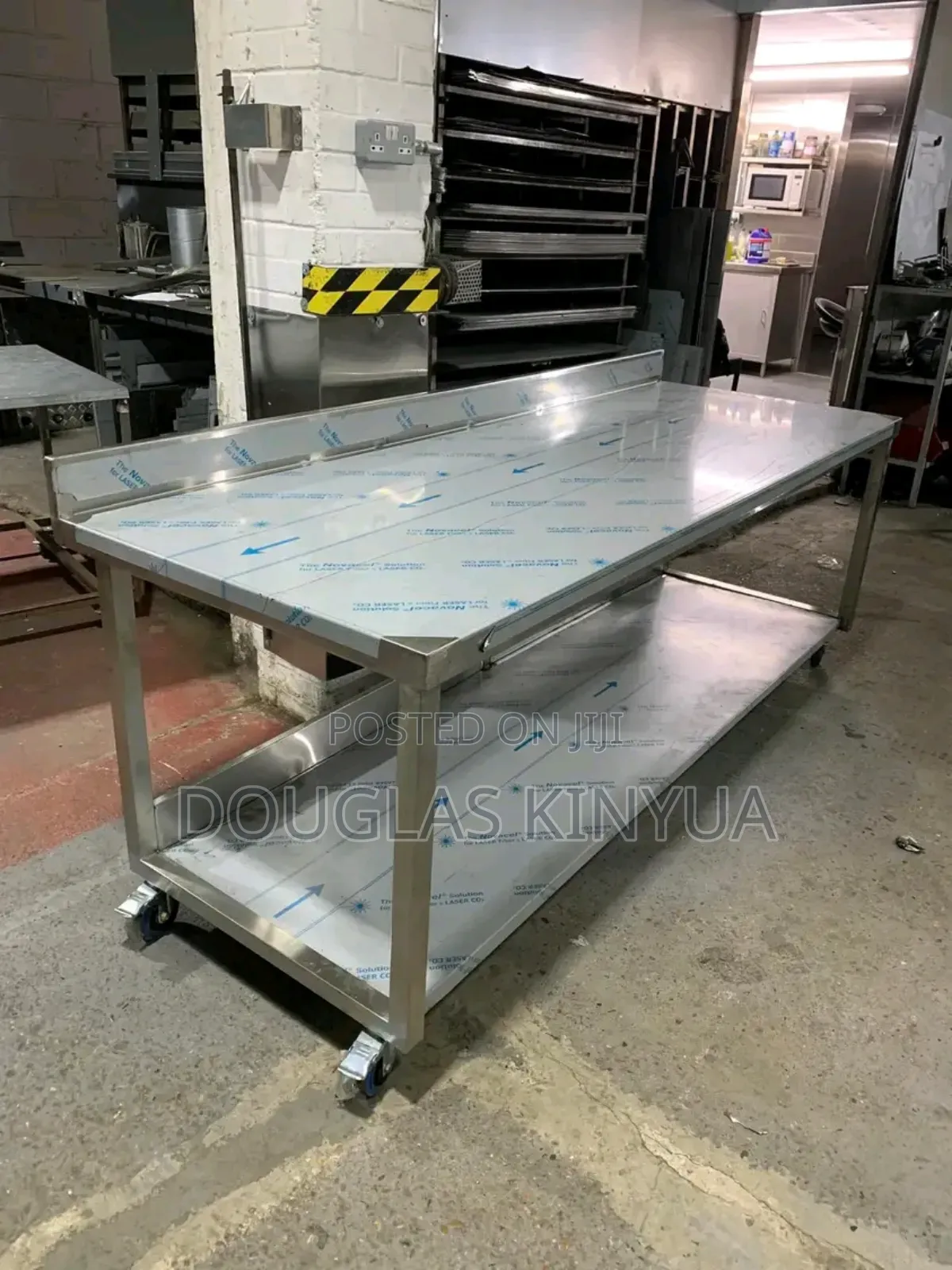 Moving Stainless Steel Working Table.
