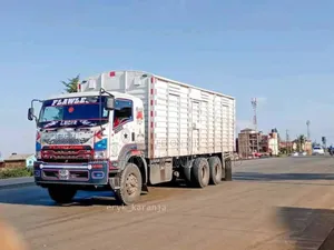Mguu Kumi. Trucks at Hand for Transport.