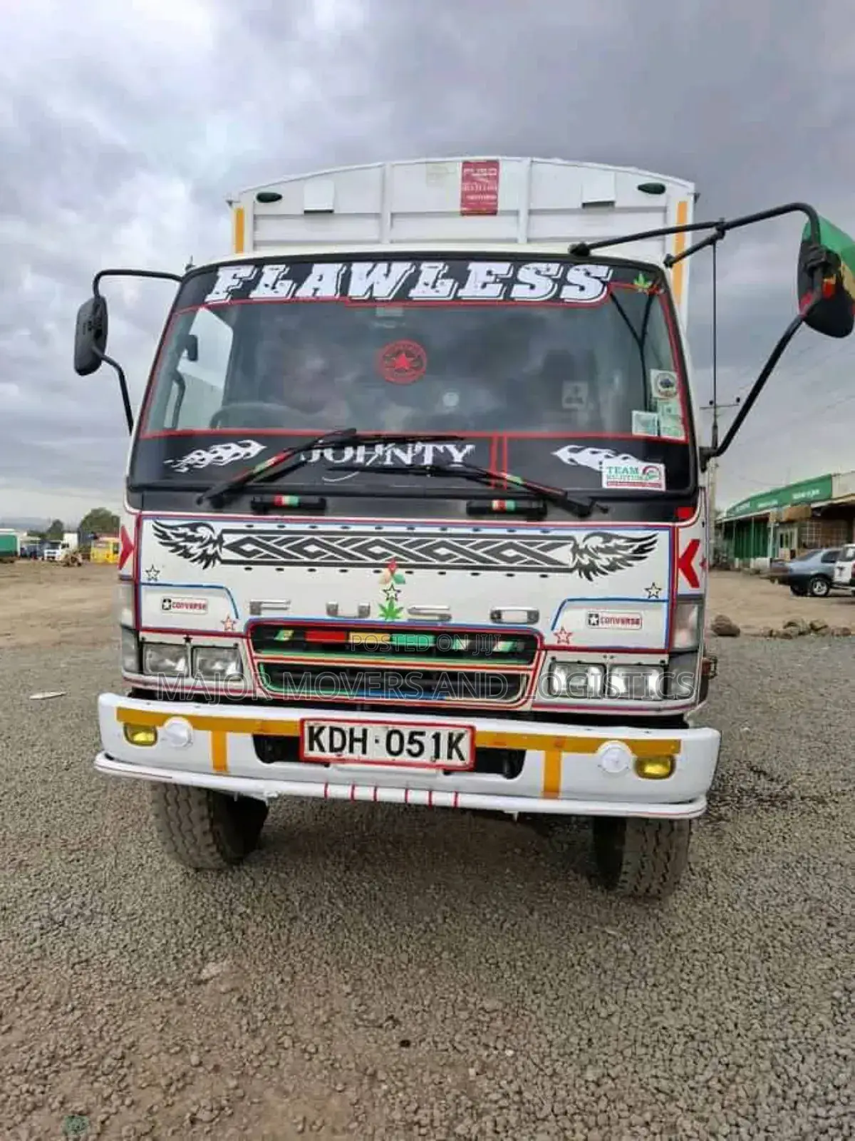 Mguu Kumi. Trucks at Hand for Transport.