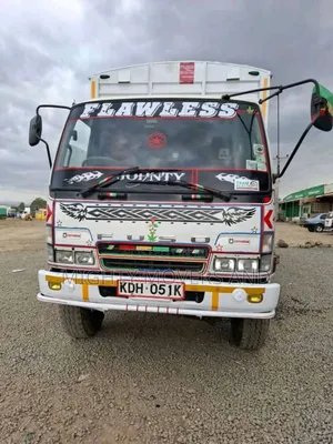 Mguu Kumi. Trucks at Hand for Transport.