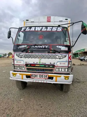 Mguu Kumi. Trucks at Hand for Transport.