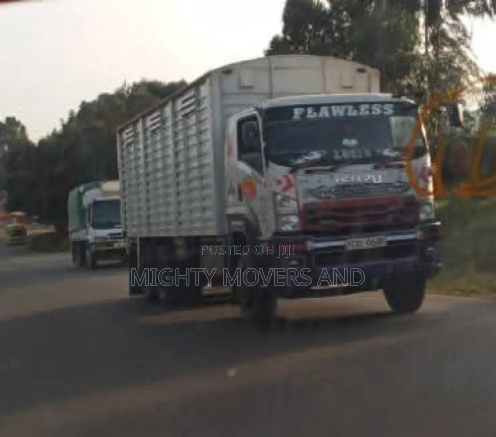 Mguu Kumi. Trucks at Hand for Transport.
