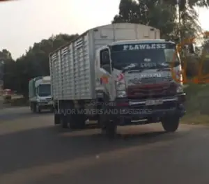 Mguu Kumi. Trucks at Hand for Transport.