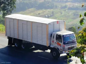 Mguu Kumi. Trucks at Hand for Transport.