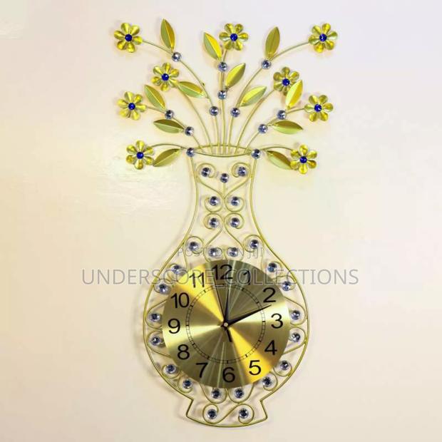 Decorative Wall Clock With a Vase Design