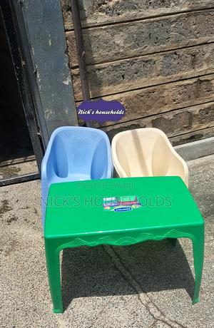 Green Table With Plastic Chairs - thumbnail 2