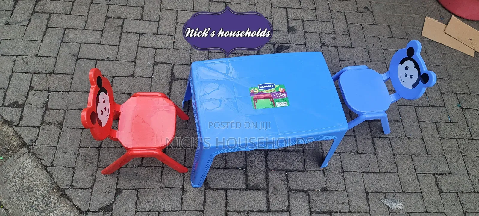 Red and Blue Plastic Chairs With a Plastic Table