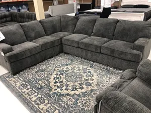 Black U Shape Couch With Throw Pillows