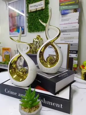 A Pair of White and Gold Ceramic Decor