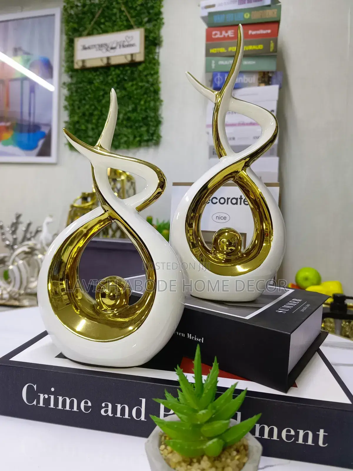 A Pair of White and Gold Ceramic Decor