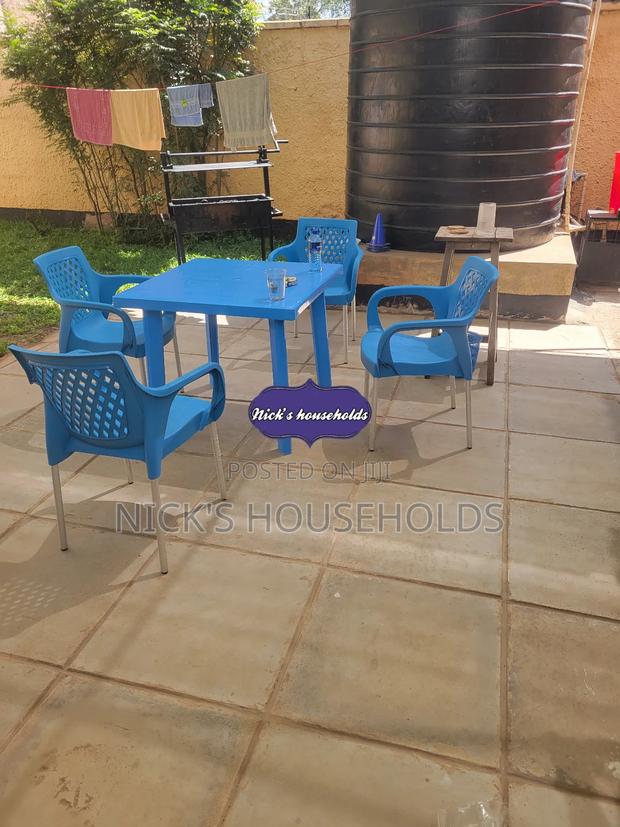 Plastic Table With Four Legs + 4 Plastic Chairs Set - main view