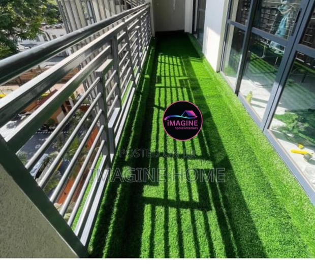 Glass Balcony With Green Grass Carpet