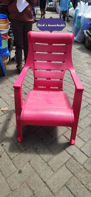 Pink Plastic Chair With Armrest Andslanting Backrest