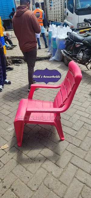 Pink Plastic Chair With Armrest Andslanting Backrest