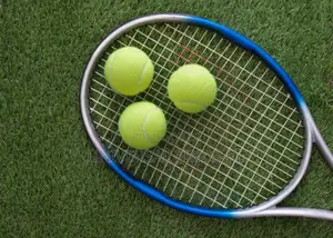 The Ultimate Tennis Racket With Green Balls