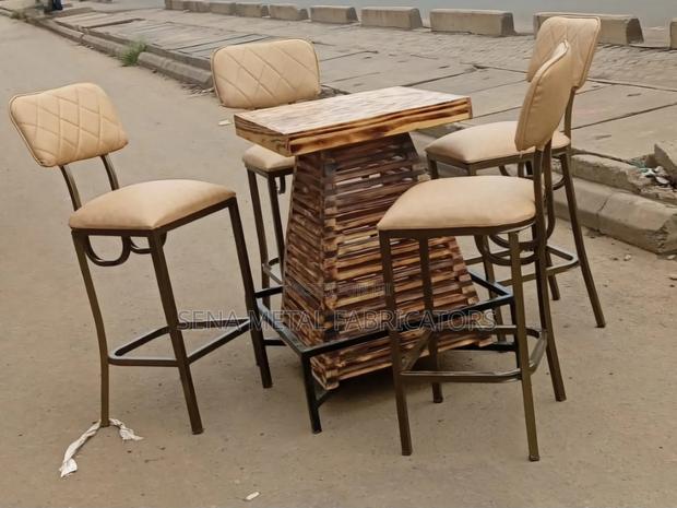 Pallet Table With a Set of High Chairs.